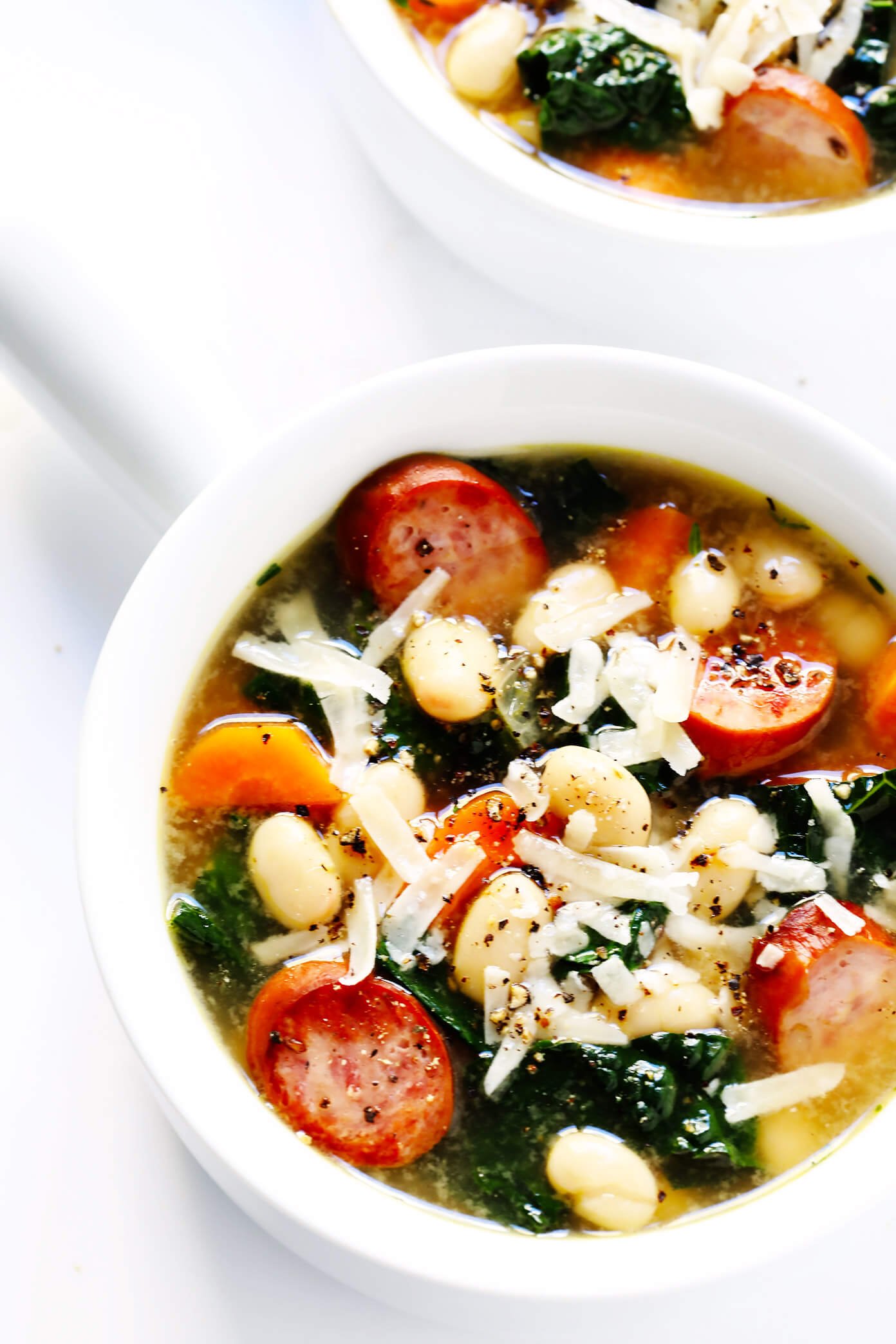 This Tuscan White Beans, Sausage and Kale Soup is one of my favorite winter dinner recipes. It's easy to make, full of cozy Italian flavors, and it's so warm and comforting. | Gimme Some Oven #souprecipe #healthysoup #italianrecipes