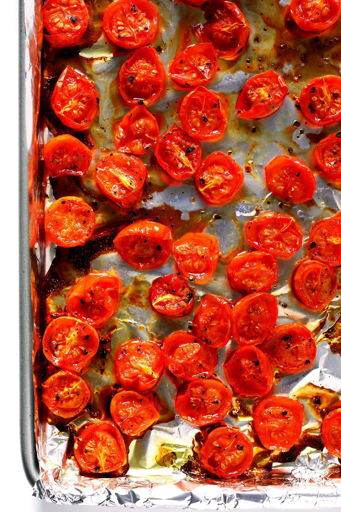 Juicy roasted tomatoes on a sheet pan