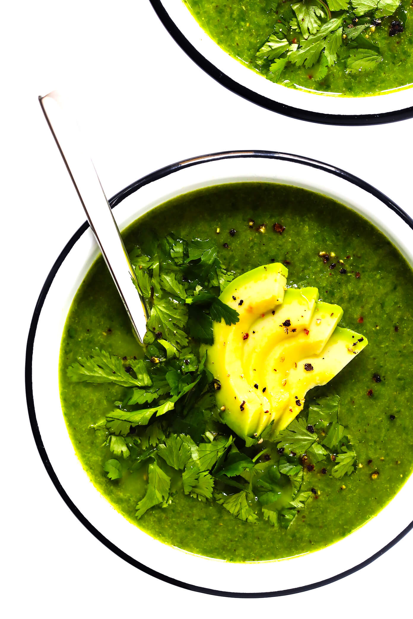 This Green Goddess Soup recipe is overflowing with feel-good veggies and greens (especially broccoli, cauliflower and spinach), it's quick and easy to make, and it tastes and feels great. Bonus? It's also naturally gluten-free and vegan. | Gimme Some Oven #greengoddess #healthyrecipes #souprecipe #broccolisoup #vegetarian Green Goddess Soup with Avocado in Bowl