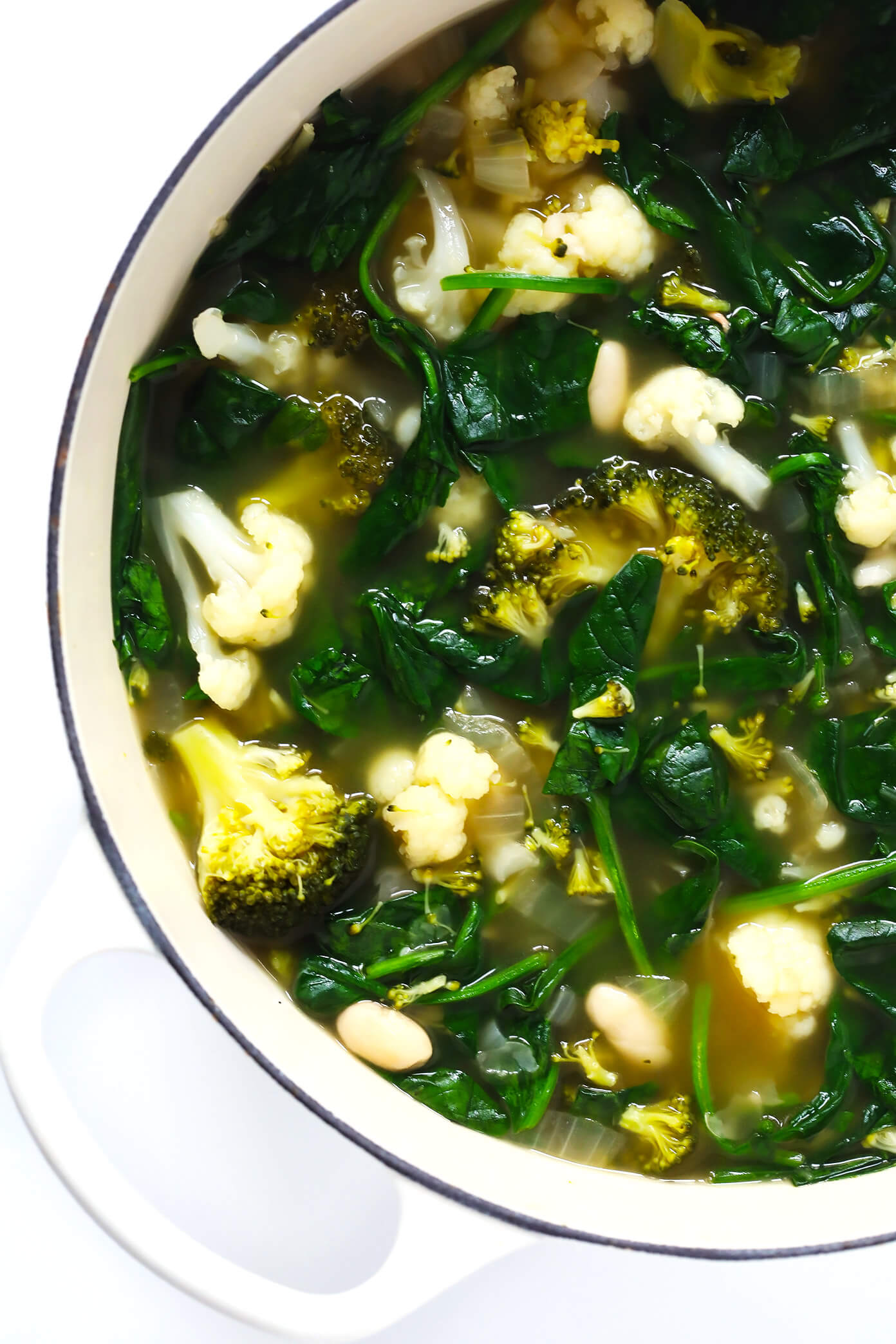 This Green Goddess Soup recipe is overflowing with feel-good veggies and greens (especially broccoli, cauliflower and spinach), it's quick and easy to make, and it tastes and feels great. Bonus? It's also naturally gluten-free and vegan. | Gimme Some Oven #greengoddess #healthyrecipes #souprecipe #broccolisoup #vegetarian Green Goddess Soup