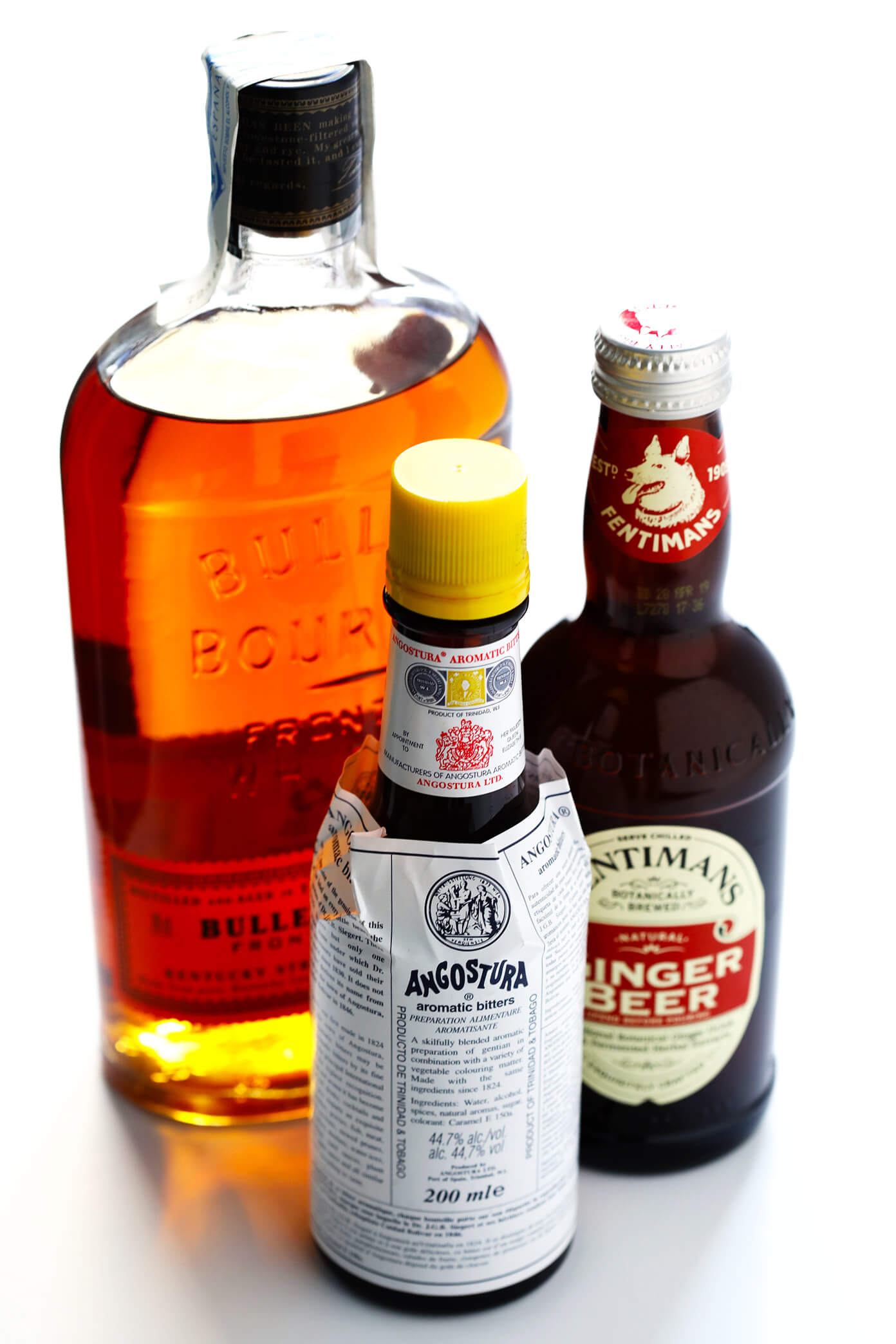 Ingredients for a Horsefeather Cocktail: bourbon, bitters, ginger beer