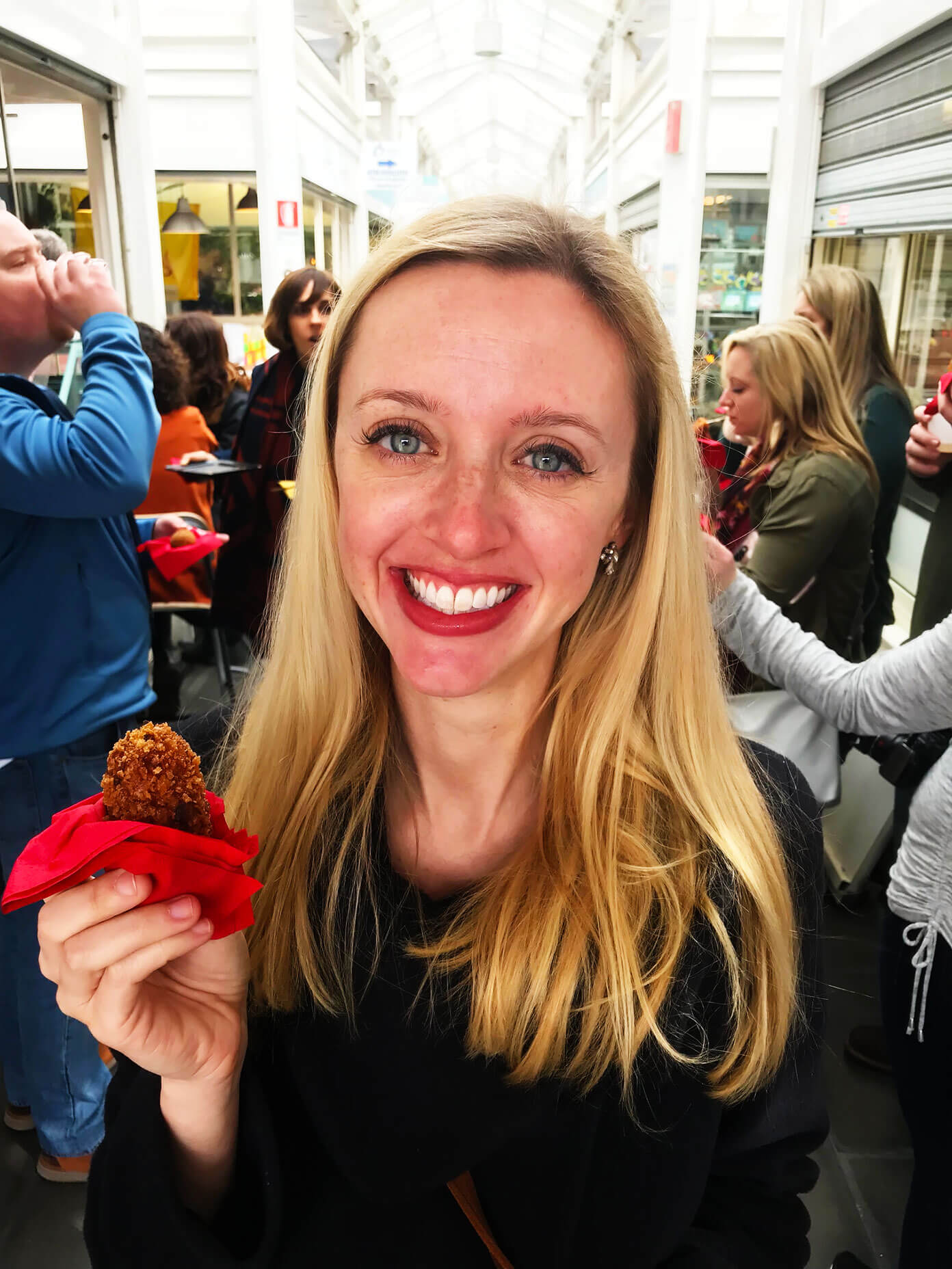 Sampling suppli on our Eating Italy Taste of Testaccio Food Tour in Rome