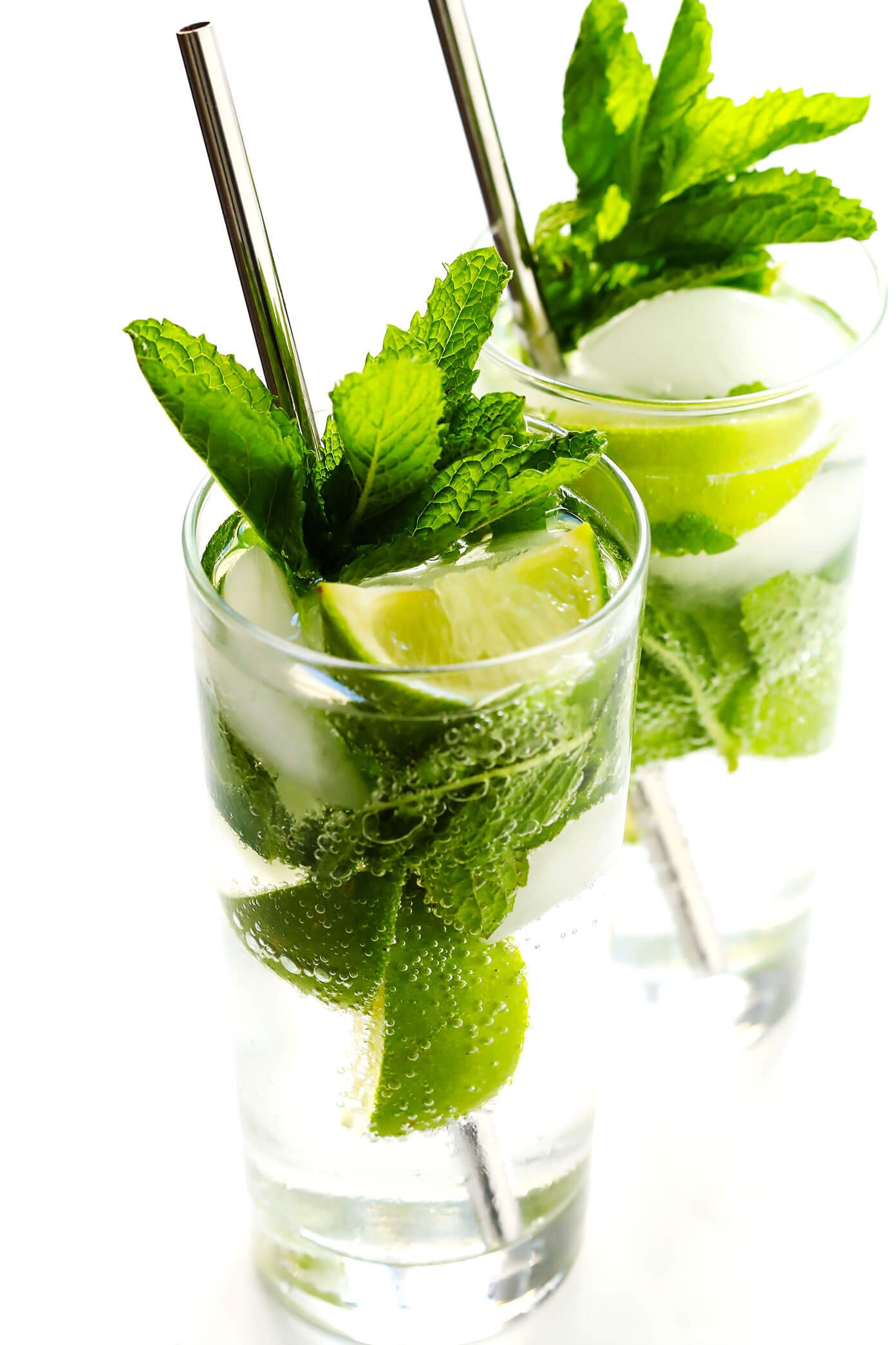 The BEST mojito recipe! It's quick and easy to make with lots of fresh mint, lime juice and rum. It's naturally sweetened with honey. And easy to make in a single cocktail serving, or as a pitcher for a crowd. The perfect summer drink! | Gimme Some Oven #mojito #cocktail #drink #summer #recipe The BEST Mojito Recipe!