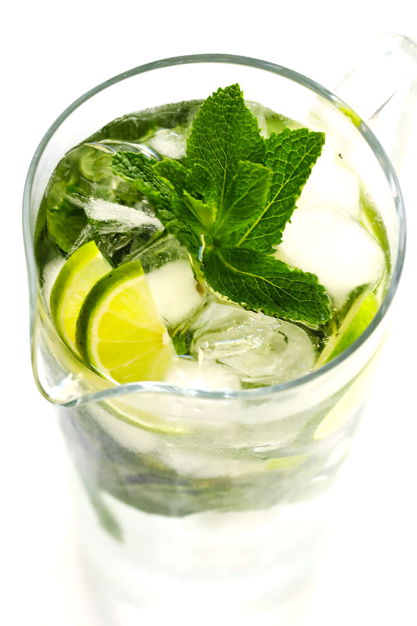 Truly the BEST mojito recipe! It's quick and easy to make with lots of fresh mint, lime juice and rum. It's naturally sweetened with honey. And easy to make in a single cocktail serving, or as a pitcher for a crowd. The perfect summer drink! | Gimme Some Oven #mojito #cocktail #drink #summer #recipe Mojito Pitcher Recipe