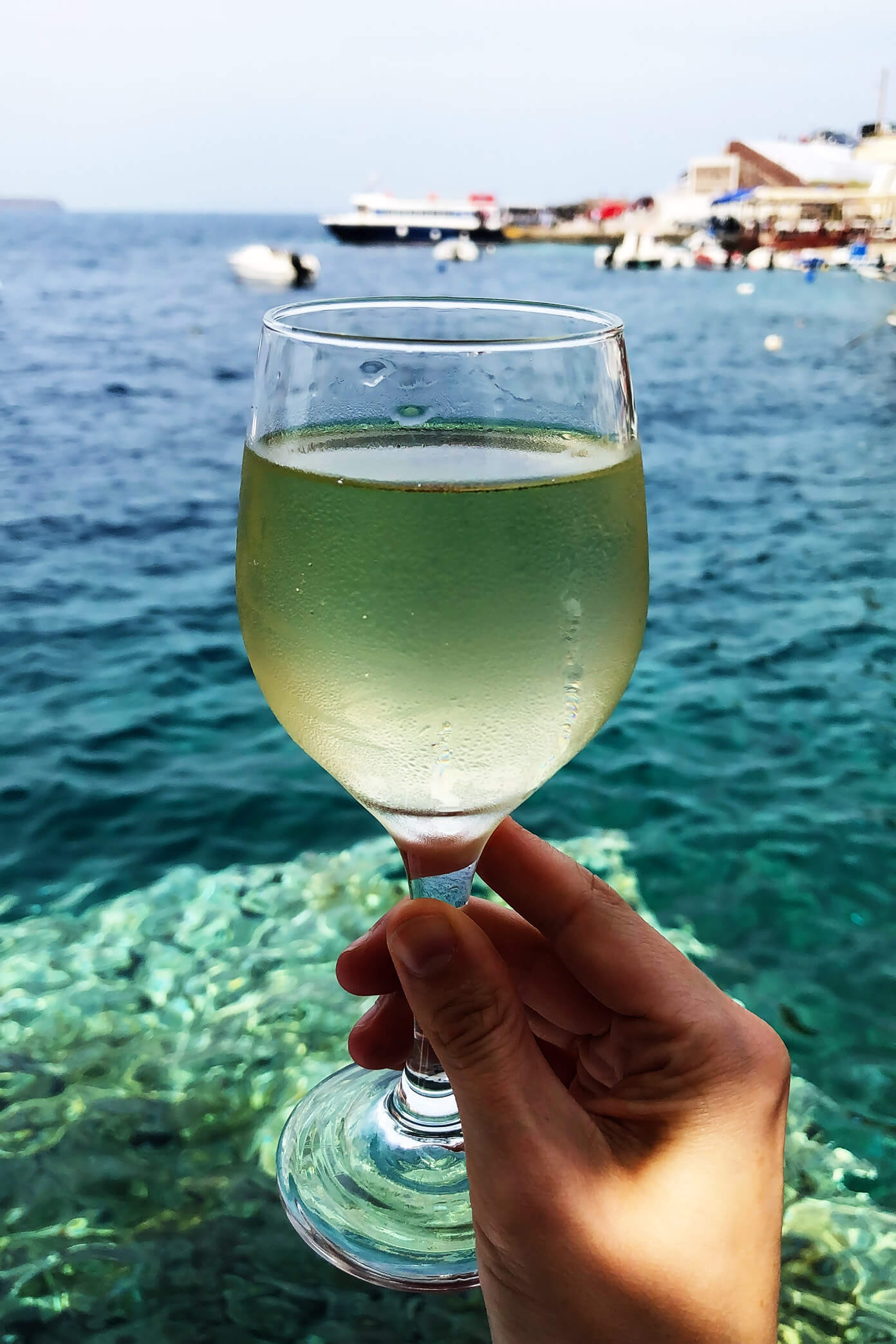 White Wine at Sunset Tavern in Santorini, Greece