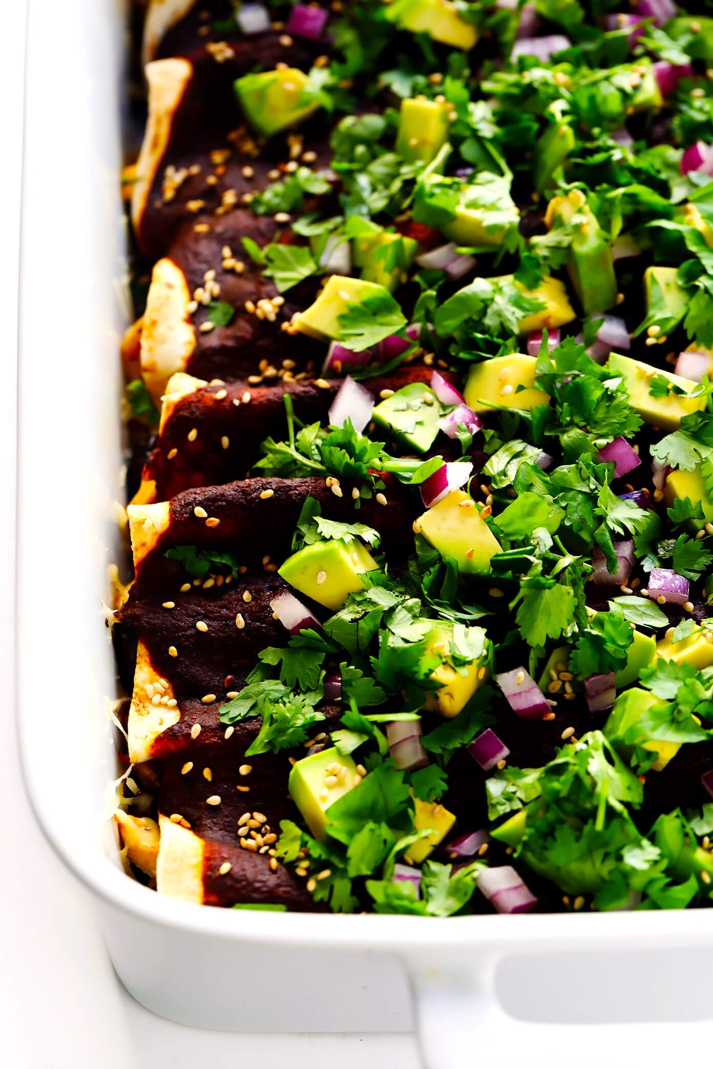 This 20-Minute Holy Mole Sauce celebrates all of the delicious, savory and slightly sweet flavors of traditional Mexican mole. But thanks to a few simple shortcuts, it's made in just a fraction of the time. Perfect for making enchiladas, tacos, nachos, chicken, veggies, roasted poblano peppers...or a thousand other possibilities. Tips included too for how to make this recipe gluten-free. | Gimme Some Oven #mexican #mole #sauce #vegan #vegetarian #dinner #glutenfree #healthy Chicken Holy Mole Enchiladas Recipe