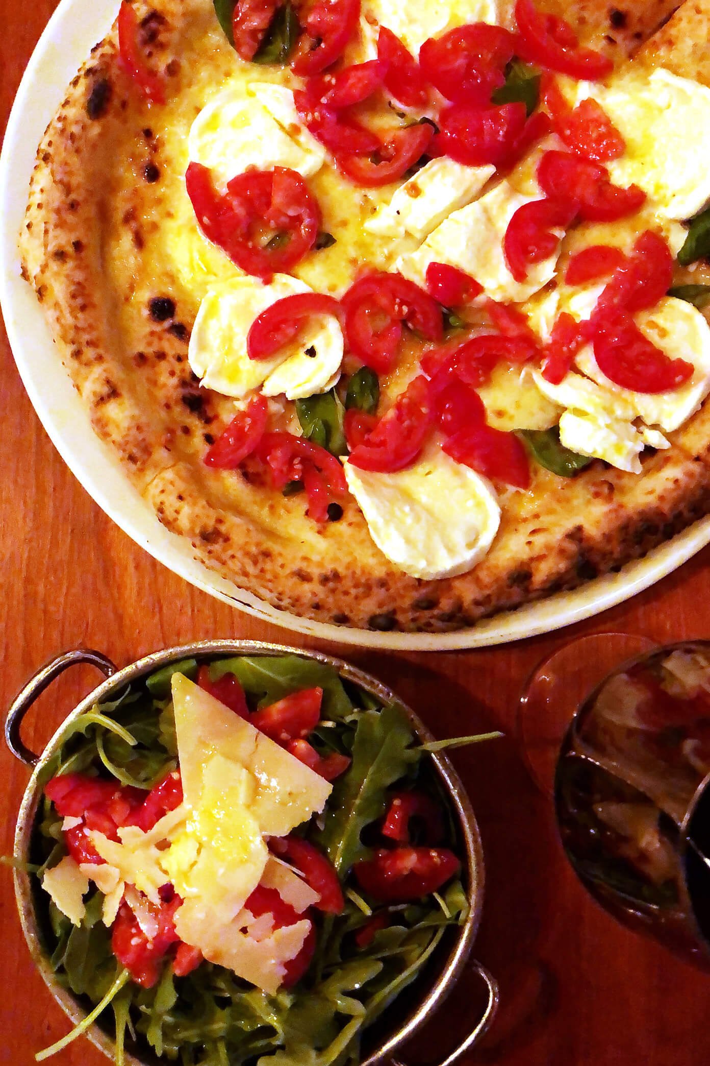 Buffalo Cheese Mozzarella Pizza and Arugula Salad at Giro in Stockhom, Sweden