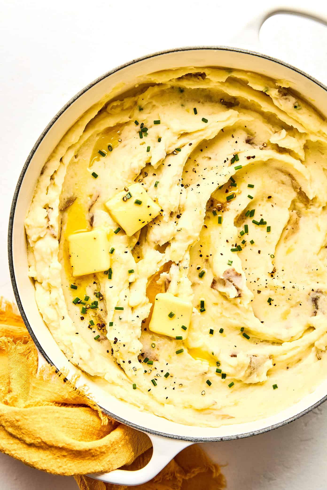 My all-time favorite mashed potatoes recipe! These homemade mashed potatoes are perfectly rich and creamy and buttery, full of great flavor, easy to make, and always a crowd fave. Perfect for Thanksgiving or other holidays, or just as a delicious side dish for any weeknight dinner. Feel free to add extra garlic or seasonings if you would like. | Gimme Some Oven #mashed #potatoes #thanksgiving #christmas #side #glutenfree #creamy #garlic #sidedish #recipe #vegetarian best mashed potatoes recipe