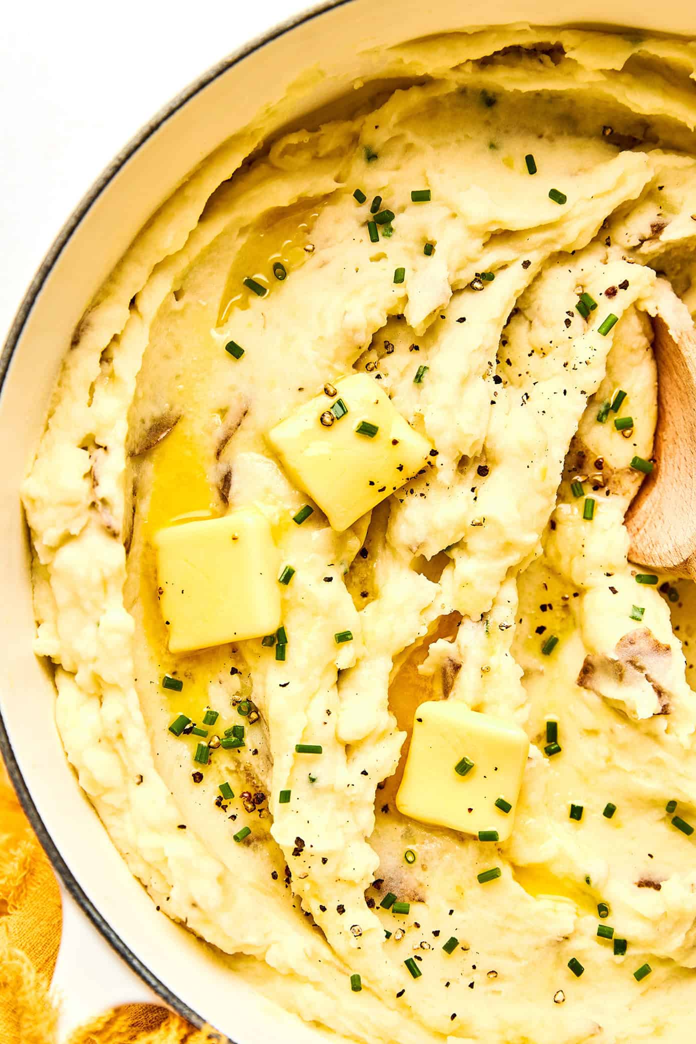 My all-time favorite mashed potatoes recipe! These homemade mashed potatoes are perfectly rich and creamy and buttery, full of great flavor, easy to make, and always a crowd fave. Perfect for Thanksgiving or other holidays, or just as a delicious side dish for any weeknight dinner. Feel free to add extra garlic or seasonings if you would like. | Gimme Some Oven #mashed #potatoes #thanksgiving #christmas #side #glutenfree #creamy #garlic #sidedish #recipe #vegetarian mashed potatoes with butter