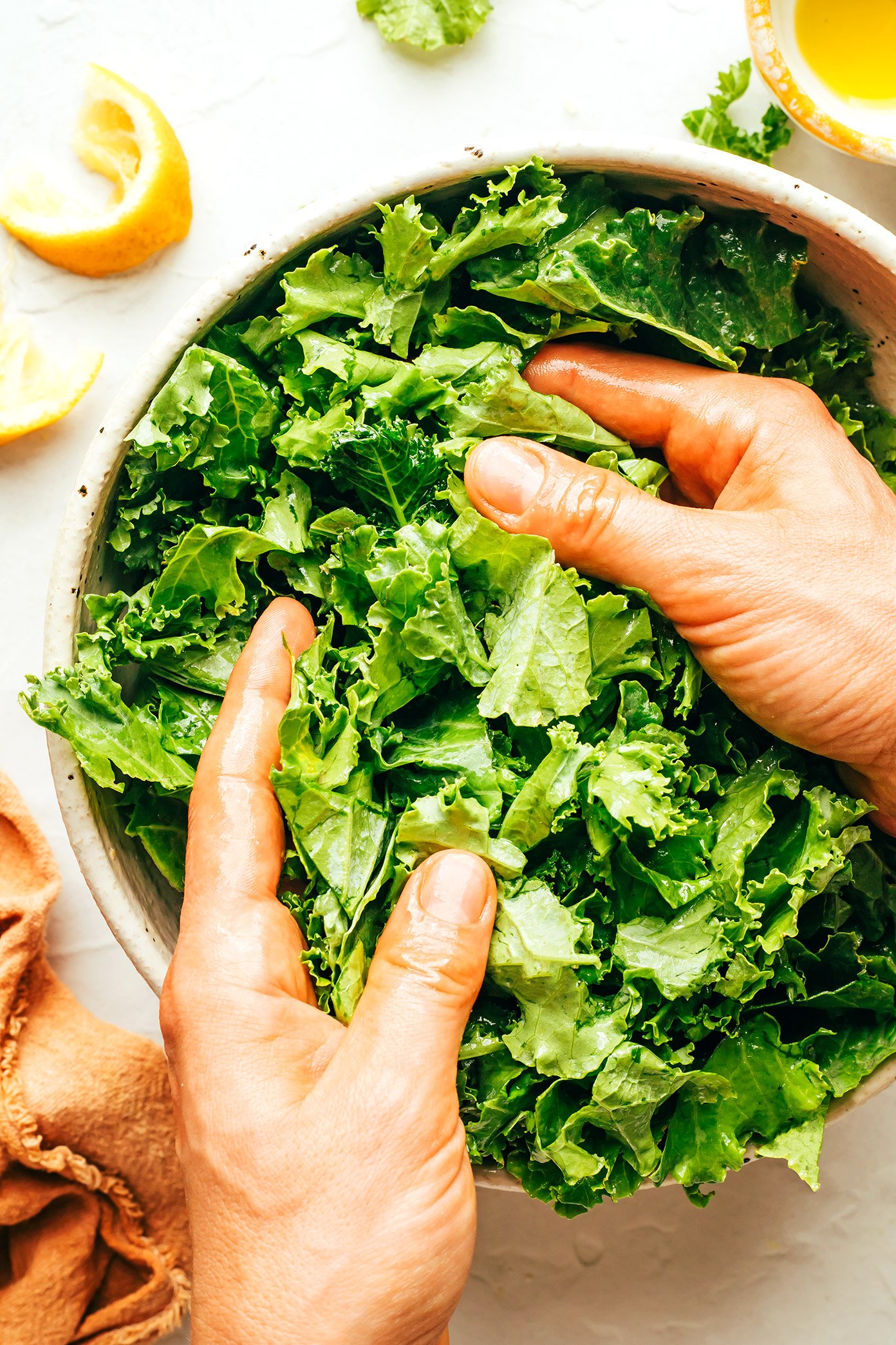 Demonstrating how to massage kale