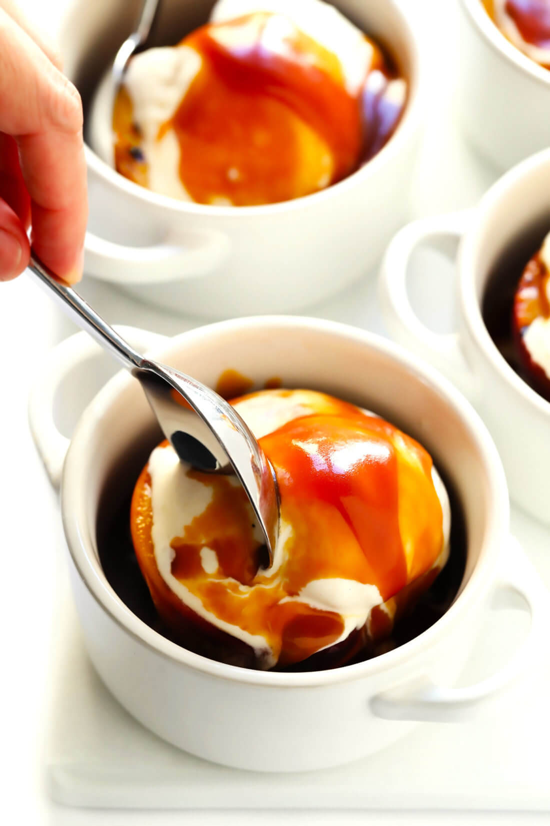 Grilled peaches with ice cream and bourbon caramel sauce