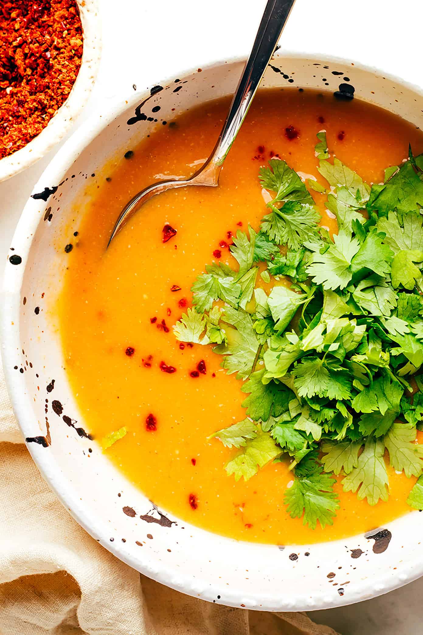 Closeup bowl of Turkish lentil soup with cilantro