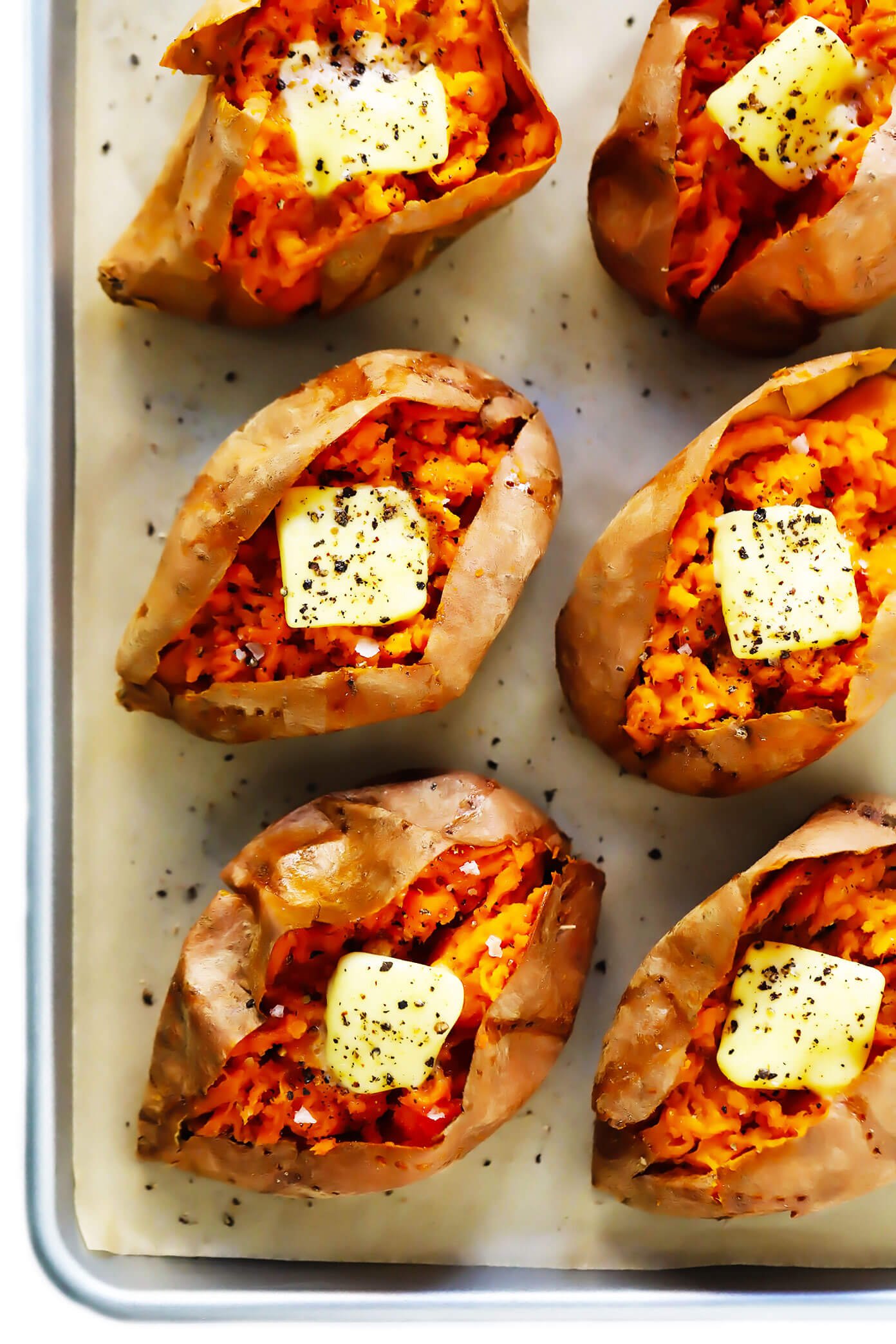 Oven baked sweet potatoes with butter, salt and pepper