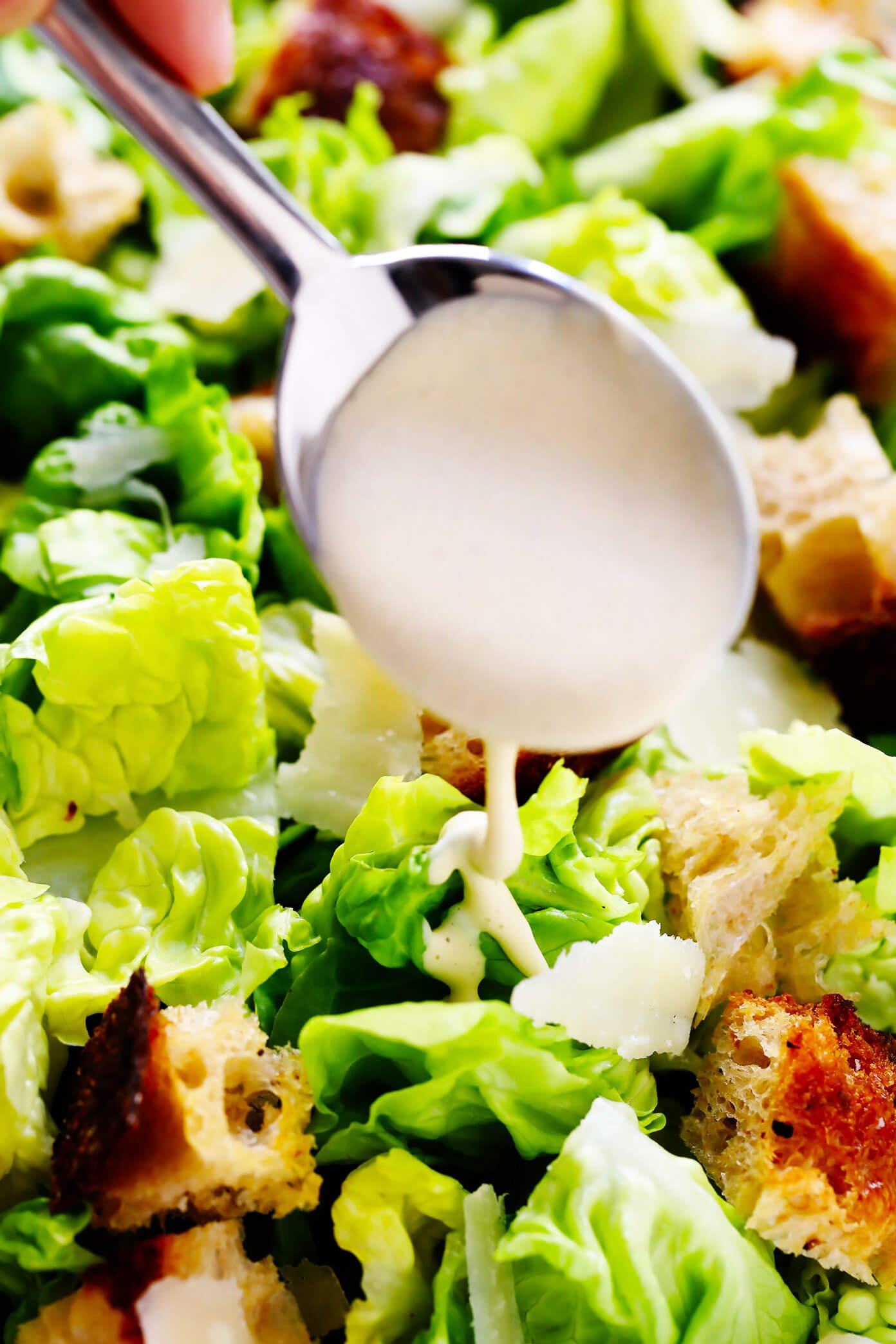 Caesar Dressing Drizzled On Caesar Salad