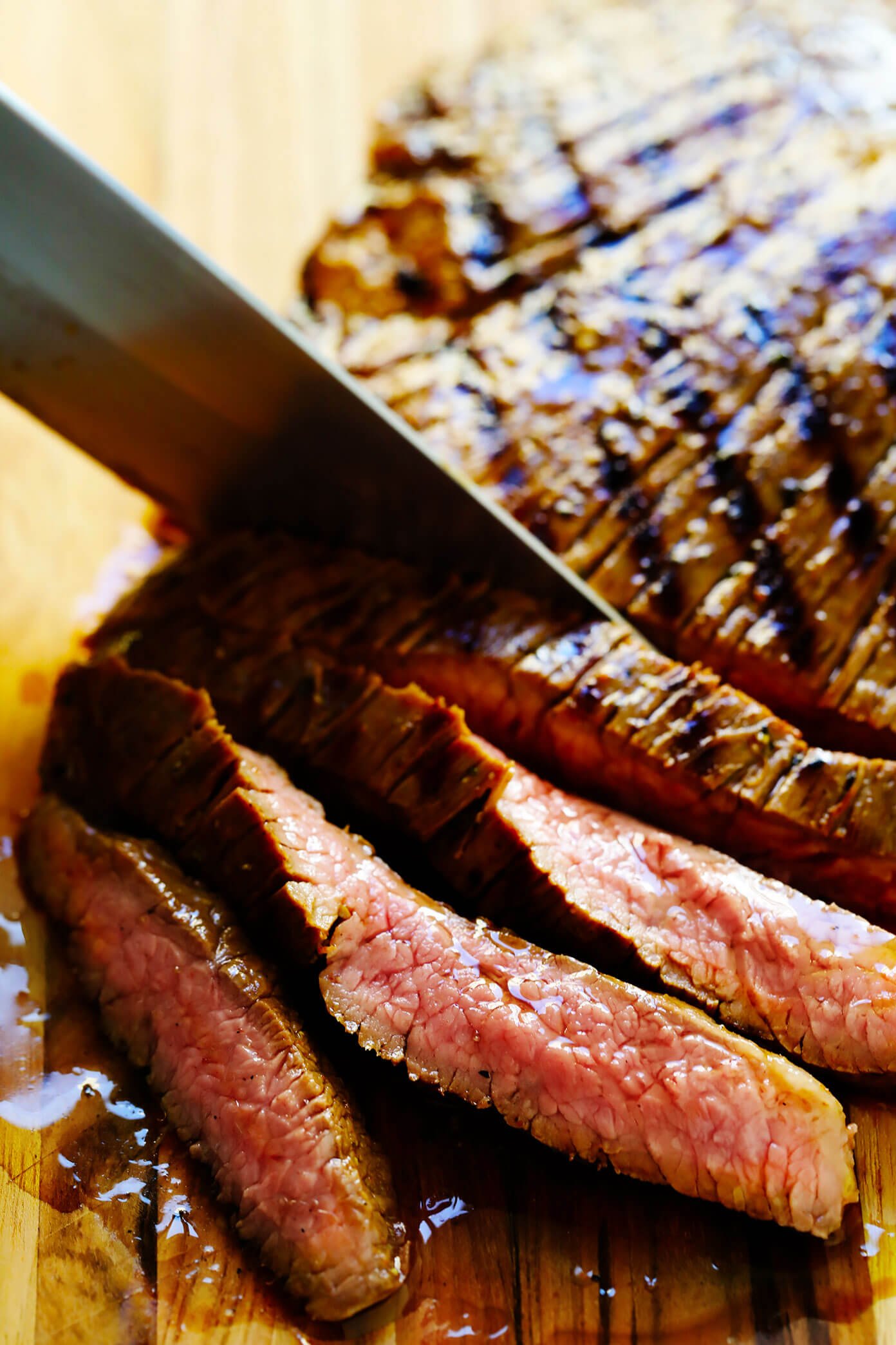 Slicing carne asada against the grain