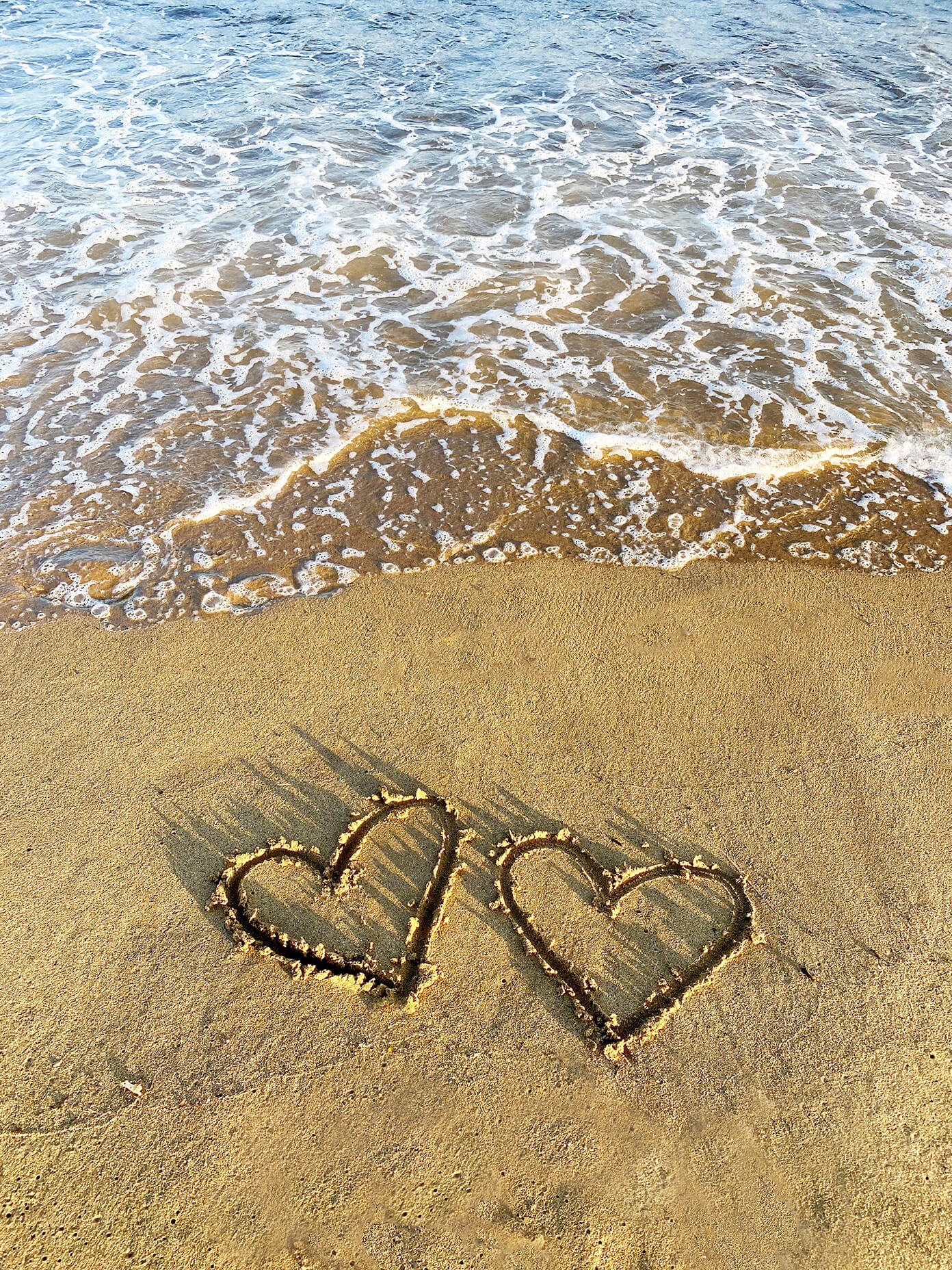 Two hearts in the sand