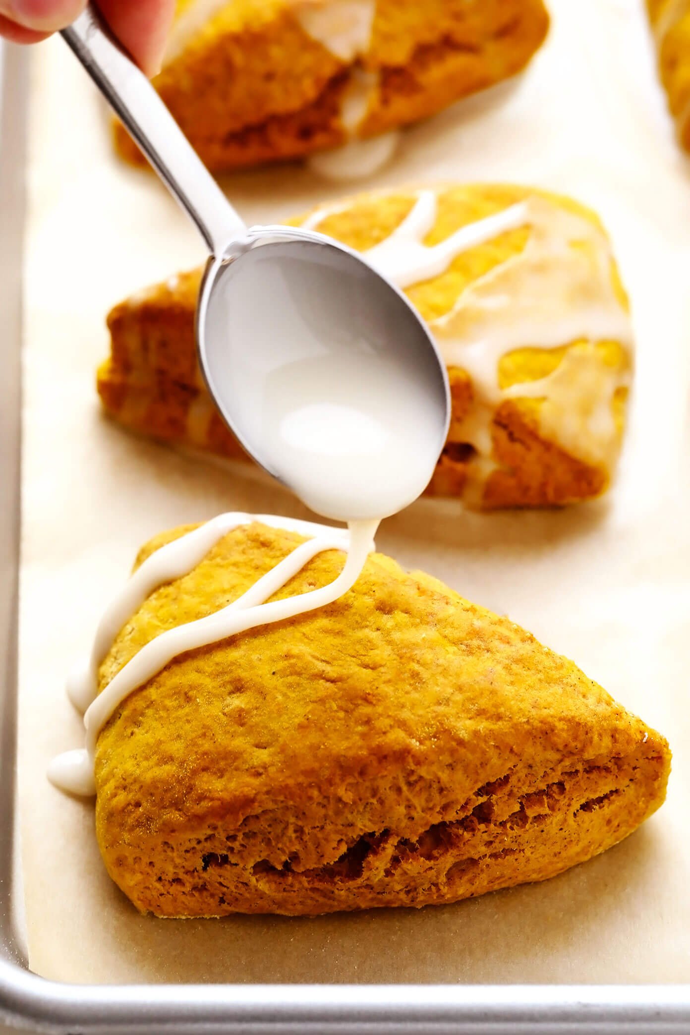 Drizzling Vanilla Glaze on Pumpkin Scones