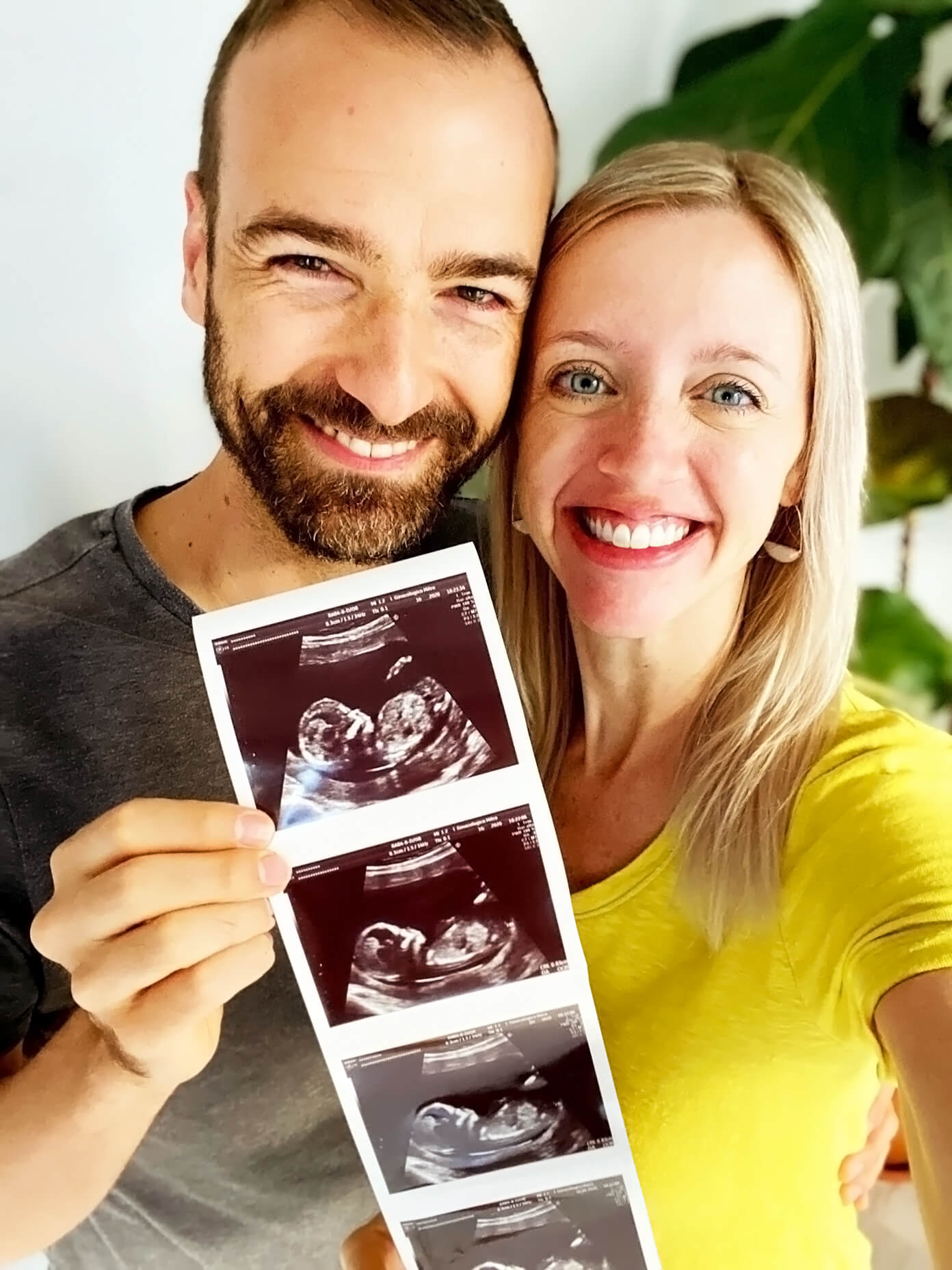 Ali and Barclay Holding Sonogram Photos