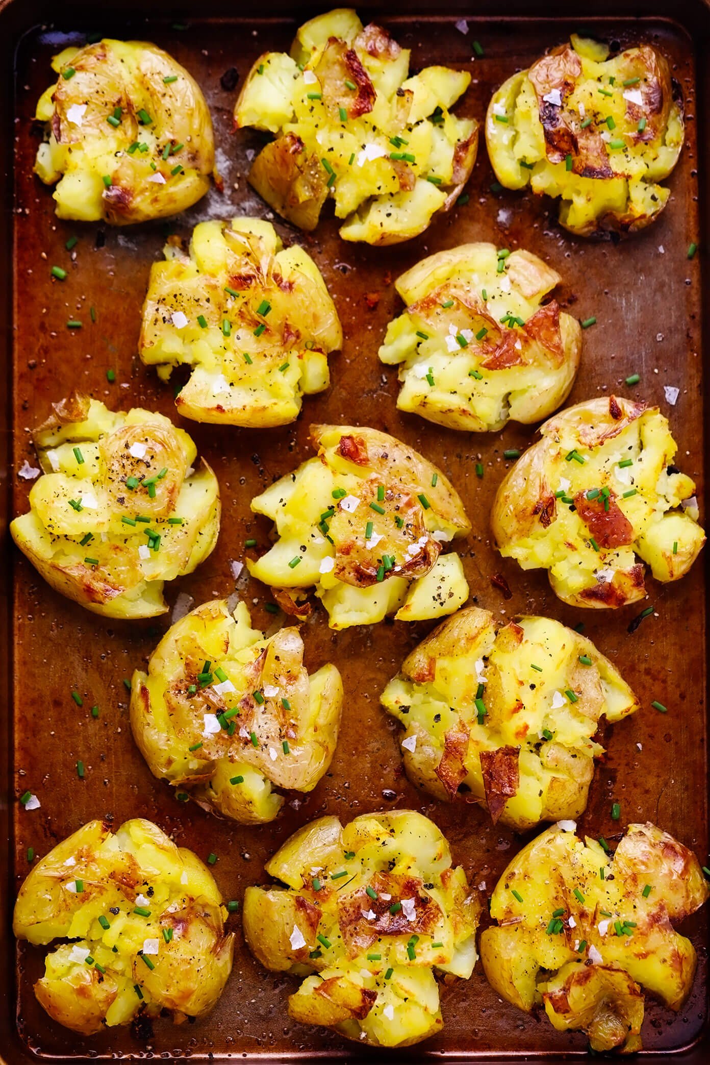 Garlic smashed potatoes on baking sheet