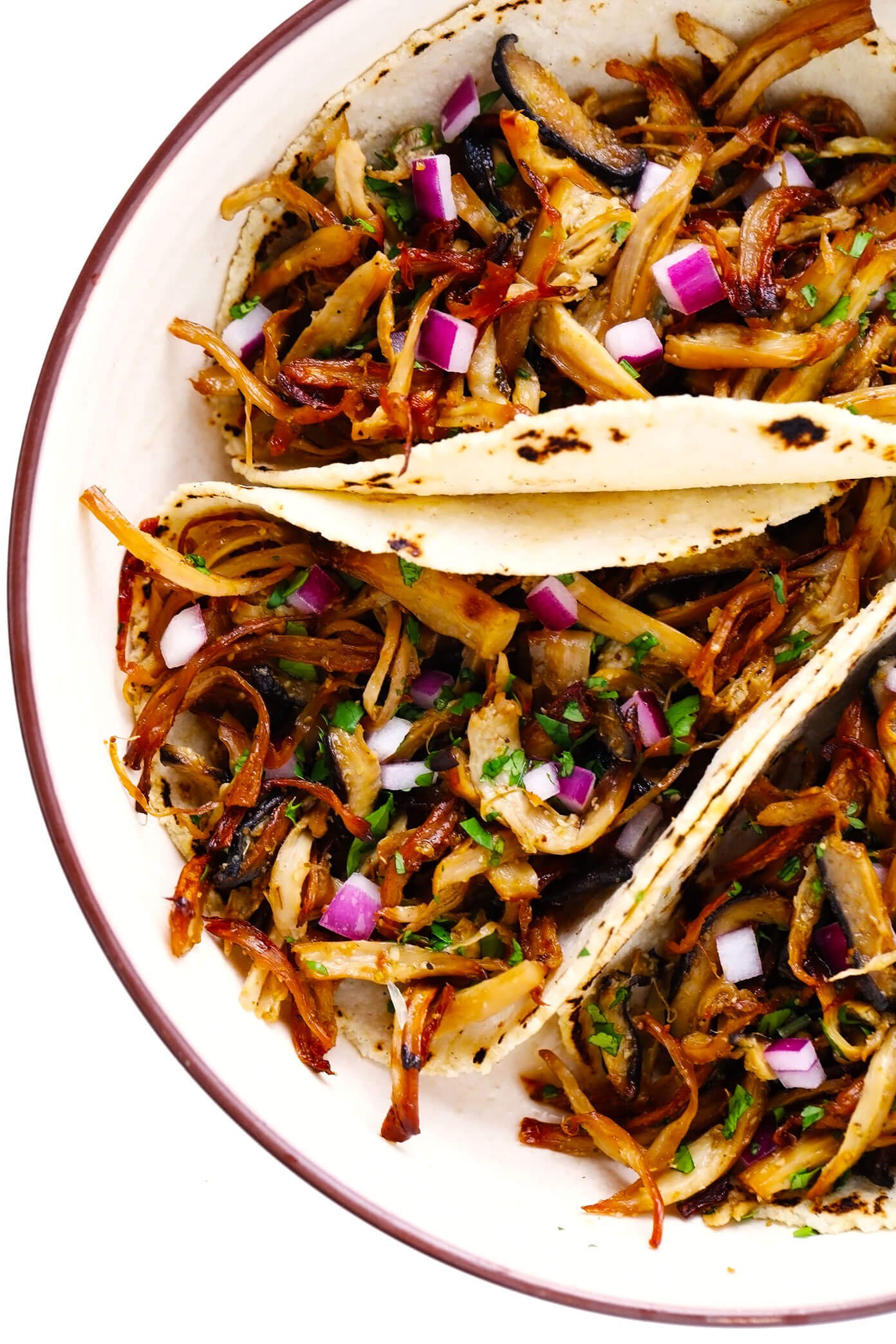 Plate of Mushroom "Carnitas" Tacos with Red Onion and Cilantro