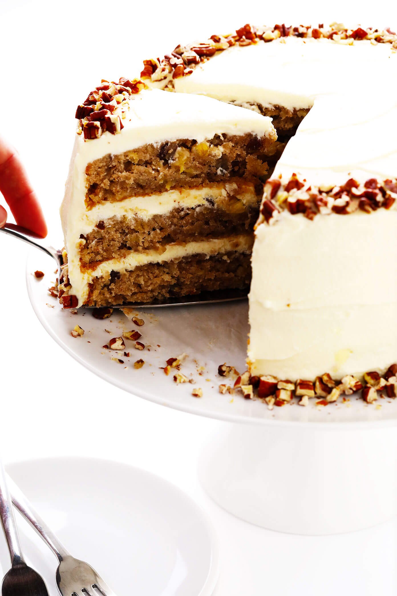 Cutting a slice of hummingbird cake