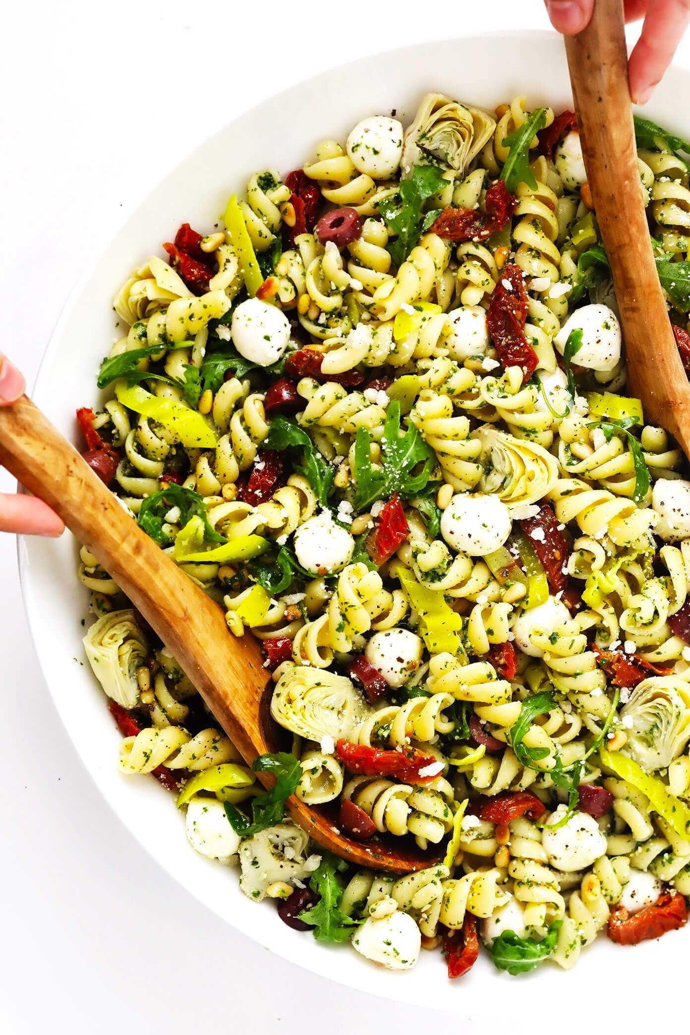 Italian Pesto Pasta Salad in Bowl with Tongs