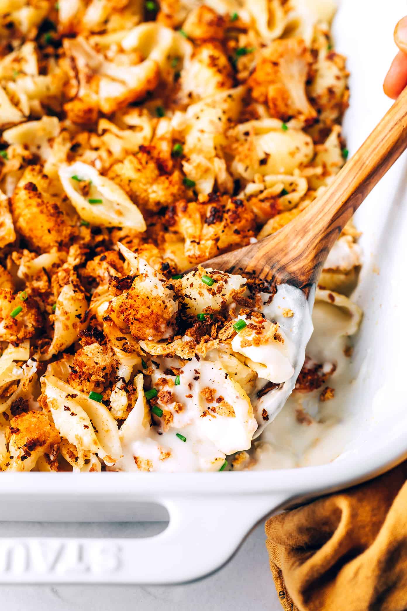 Closeup of roasted cauliflower macaroni and cheese in pan