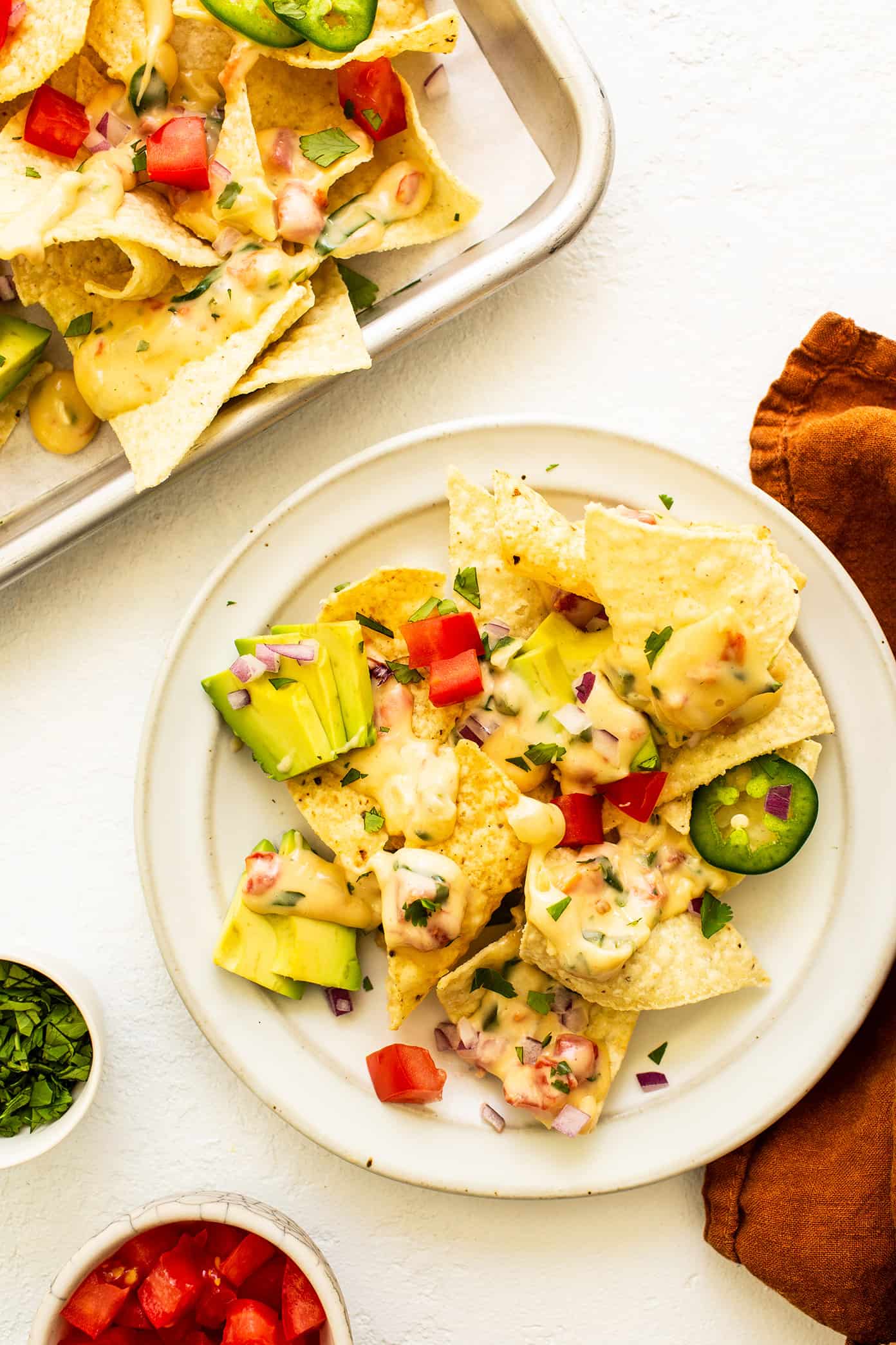 Plate of homemade nachos with avocado