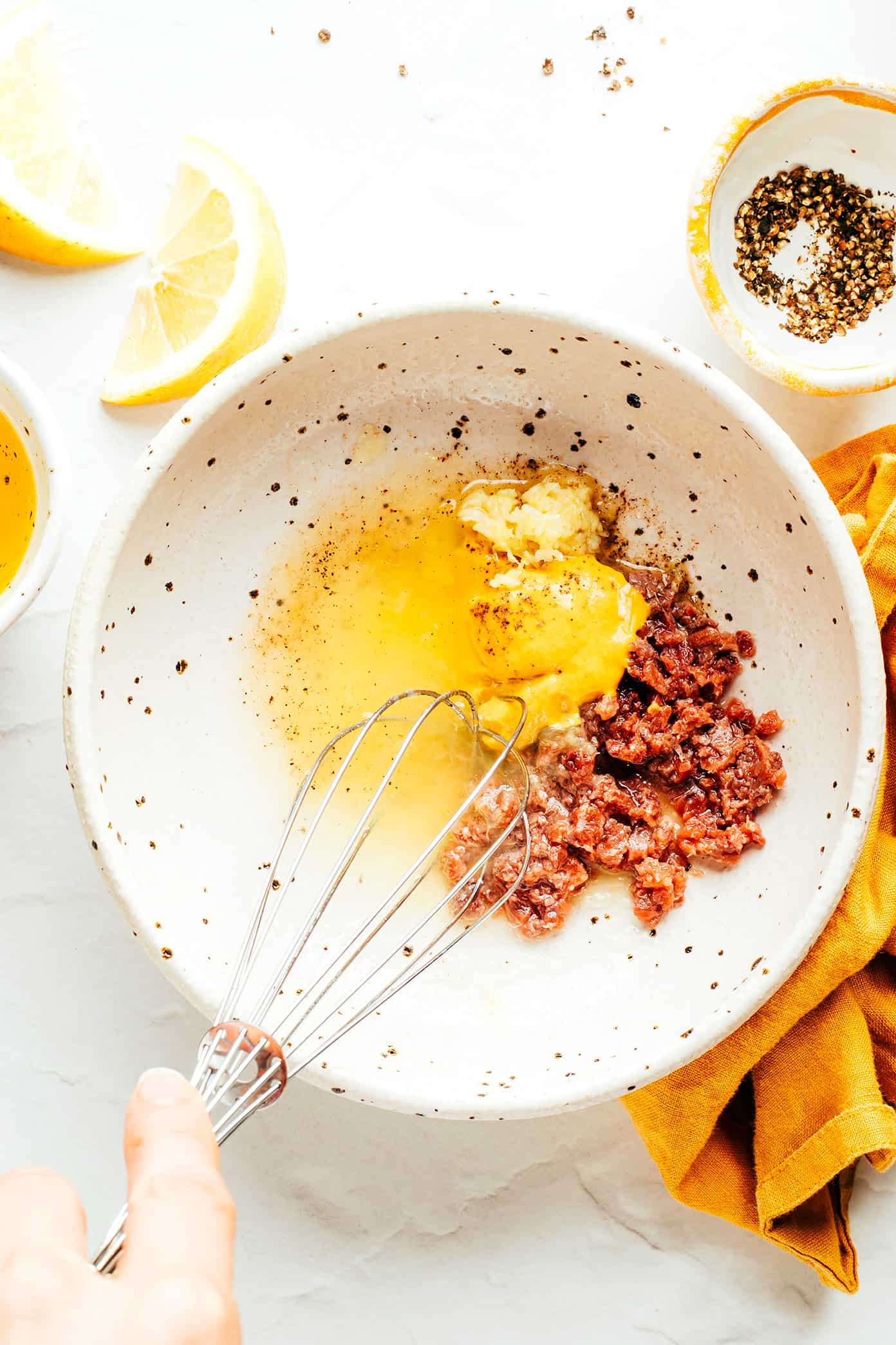 Whisking anchovy vinaigrette