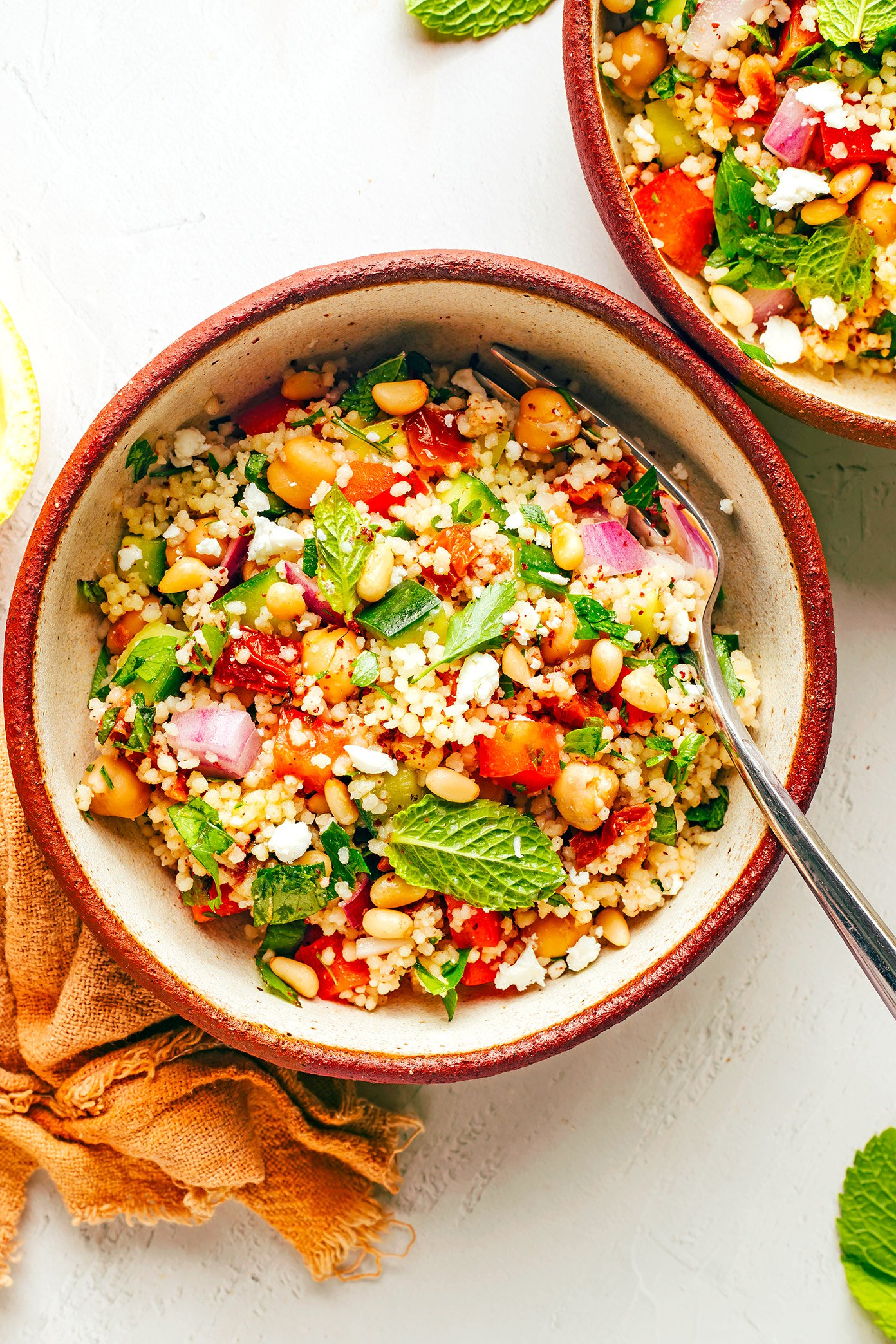 Serving bowls of couscous salad