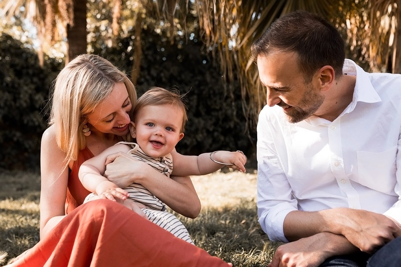 Family snuggles in the park