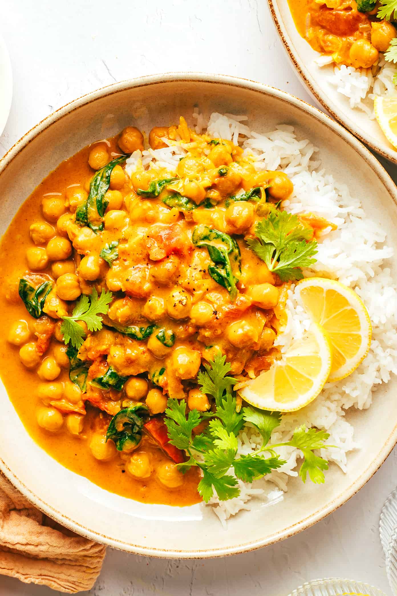 Easy Chickpea Curry with Rice and Lemons in Serving Bowls