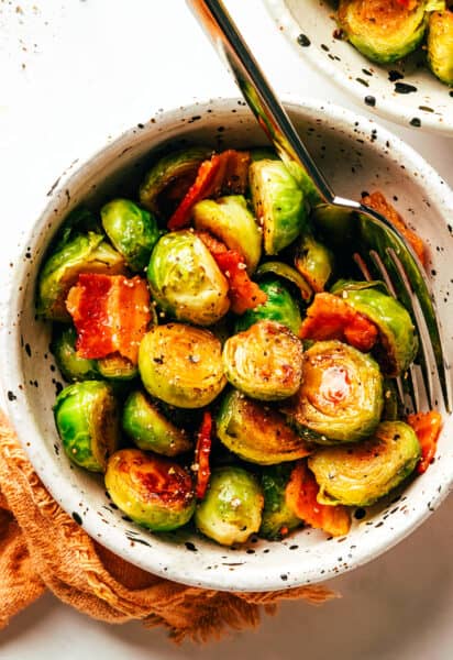 https://www.gimmesomeoven.com/wp-content/uploads/2022/11/Bacon-Brussels-Sprouts-with-Hot-Honey-11-1-412x600.jpg