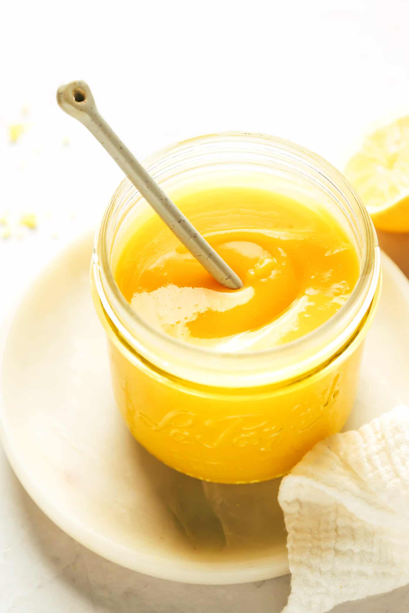 Jar of lemon curd with spoon