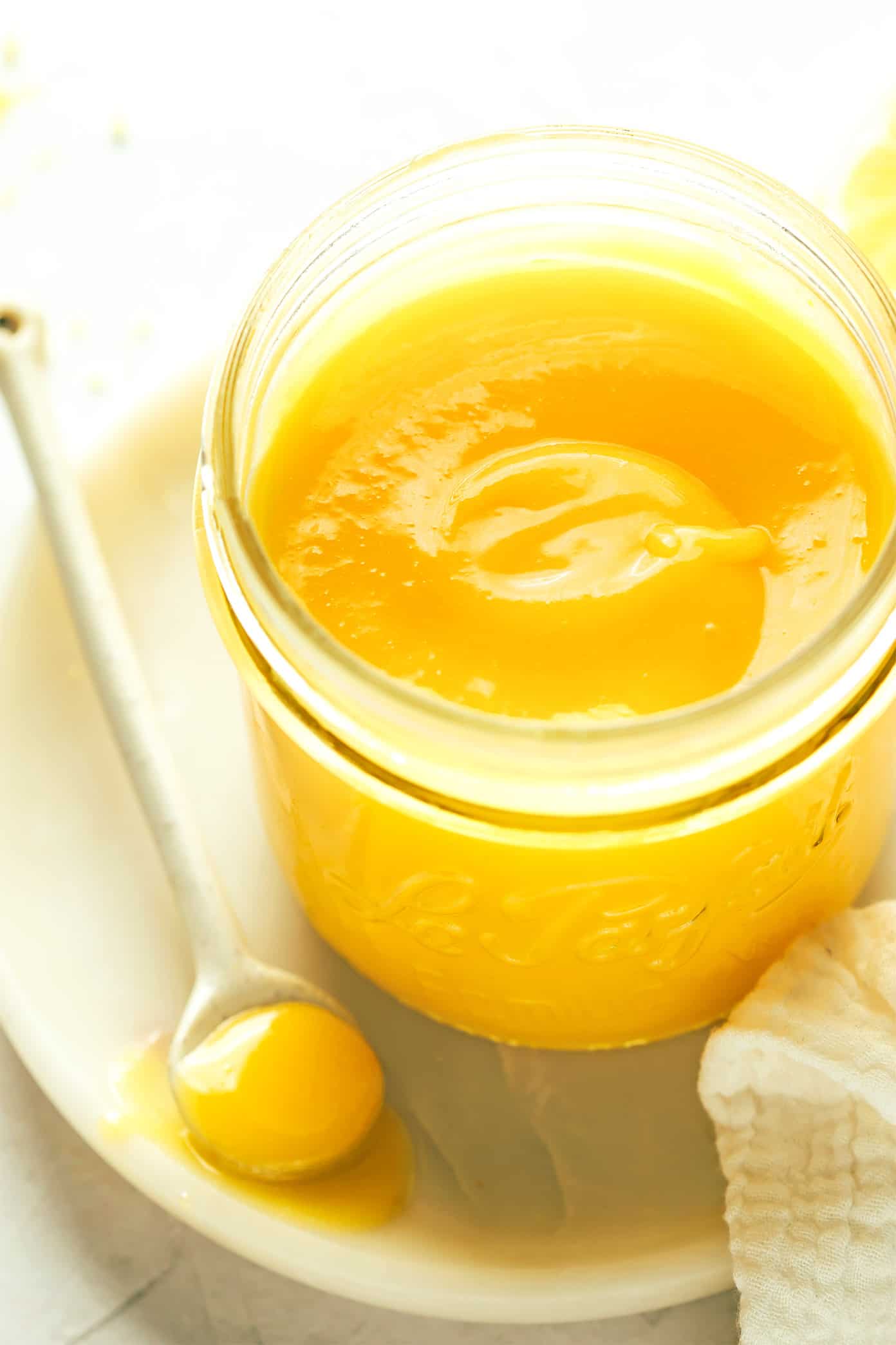 Jar of lemon curd with spoon