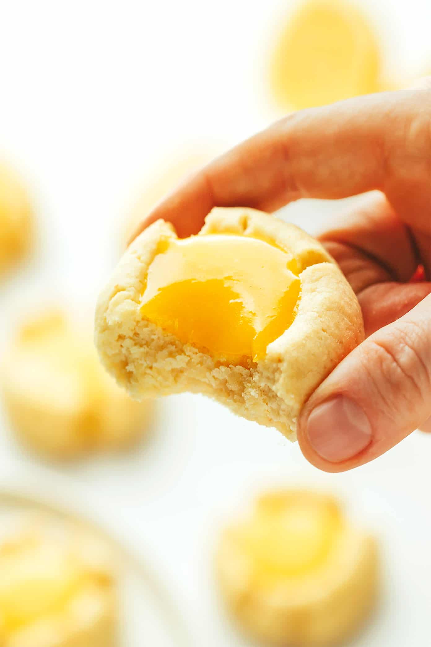 Lemon thumbprint cookie with a bite taken out