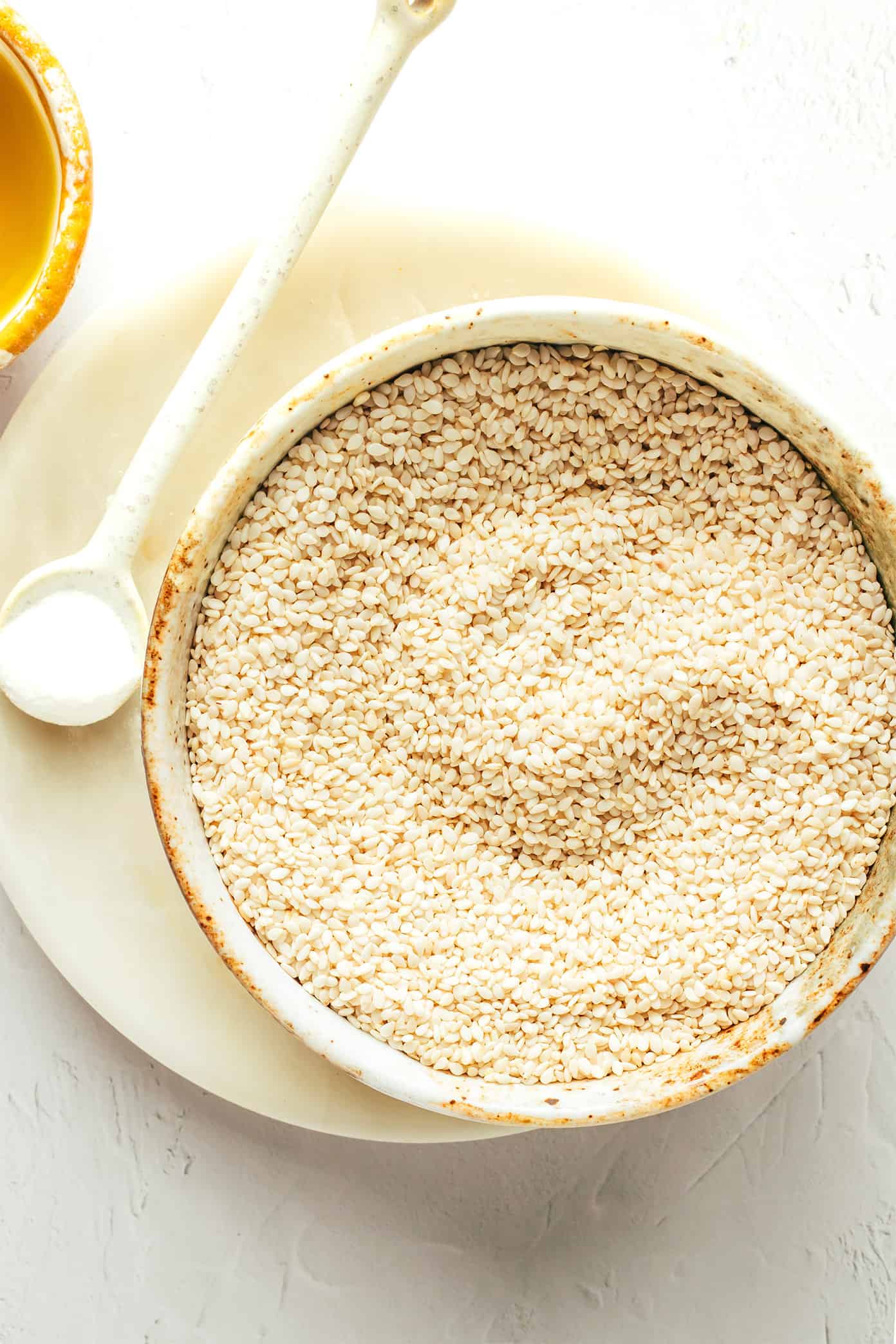 Tahini ingredients including sesame seeds, salt and olive oil