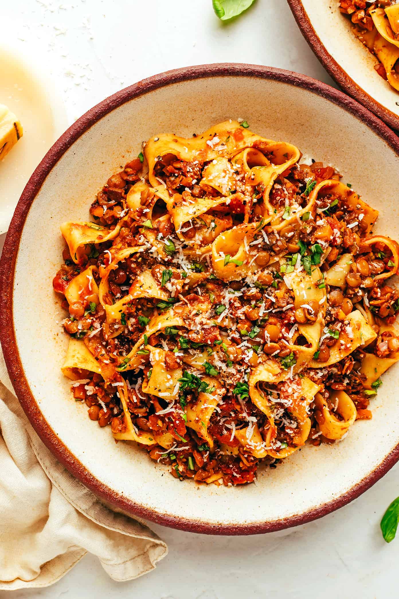 Vegetarian bolognese with pasta, parmesan and basil in bowl