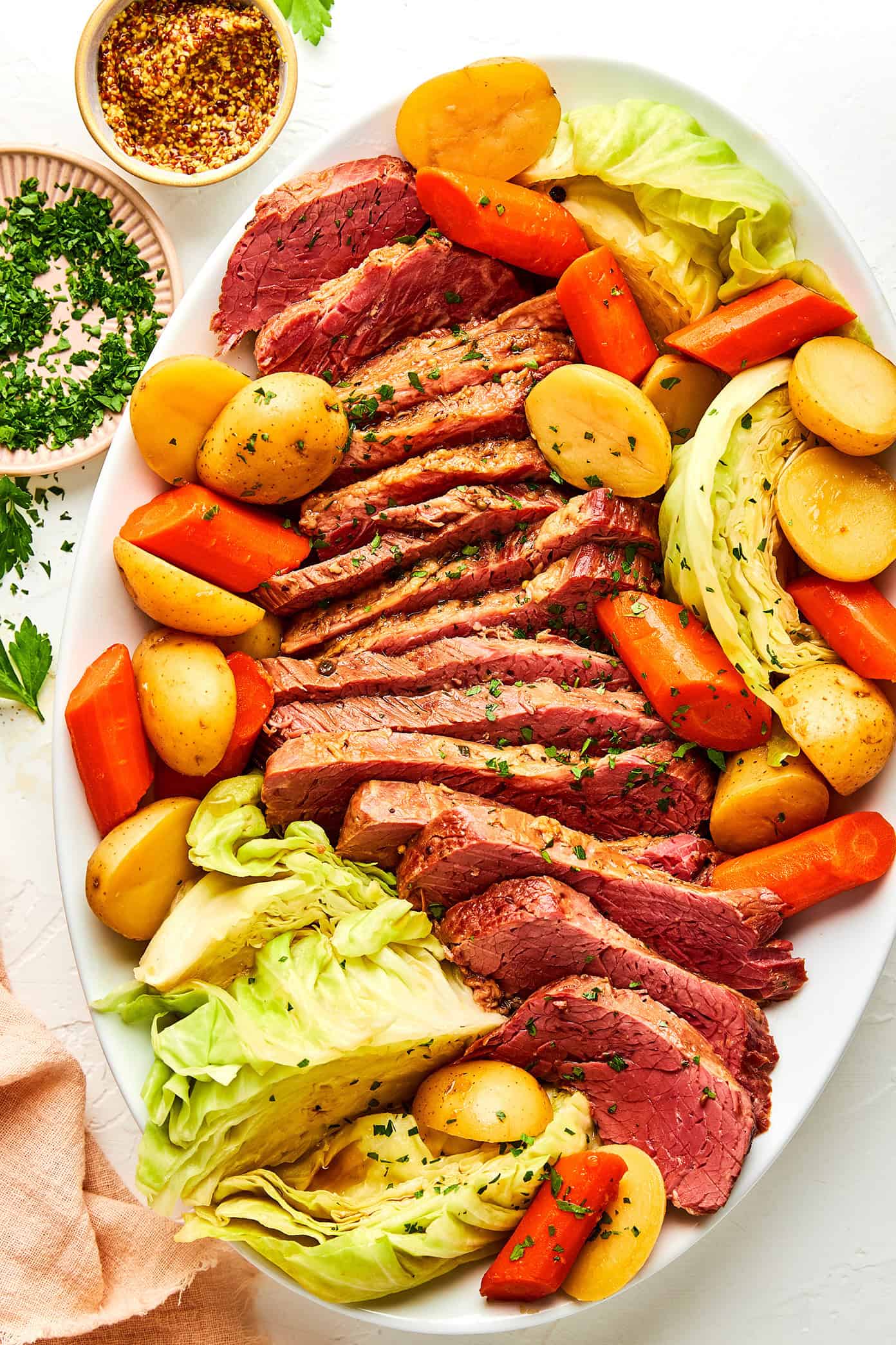 platter of corned beef and cabbage with carrots and potatoes