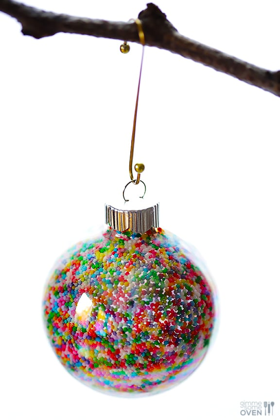 These DIY Sprinkles Ornaments are easy to make and customize with your favorite colors of sprinkles. The perfect homemade decor for your Christmas tree this year! | Gimme Some Oven