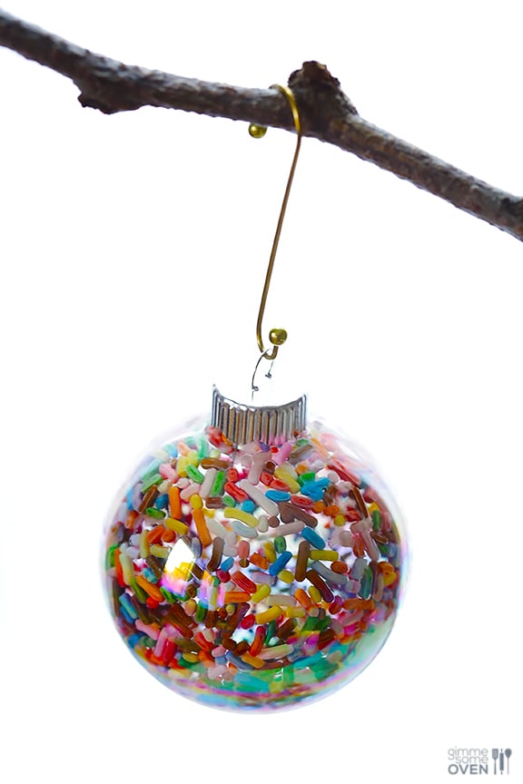 These DIY Sprinkles Ornaments are easy to make and customize with your favorite colors of sprinkles. The perfect homemade decor for your Christmas tree this year! | Gimme Some Oven