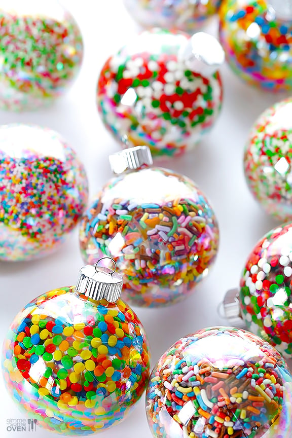 These DIY Sprinkles Ornaments are easy to make and customize with your favorite colors of sprinkles. The perfect homemade decor for your Christmas tree this year! | Gimme Some Oven